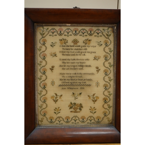 1503 - A wide mahogany framed sampler by Ann Whitehouse dated 1834, worked in coloured silks on a fine line... 