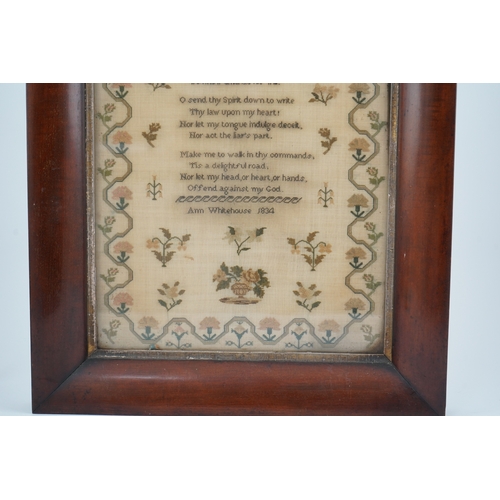 1503 - A wide mahogany framed sampler by Ann Whitehouse dated 1834, worked in coloured silks on a fine line... 