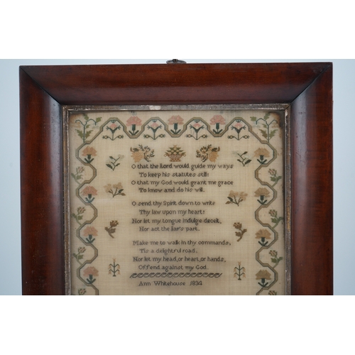 1503 - A wide mahogany framed sampler by Ann Whitehouse dated 1834, worked in coloured silks on a fine line... 