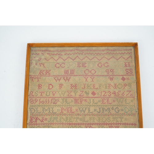 1505 - An alphabet cross stitch sampler with a figurative lower spot motif panel and commemorative dedicati... 