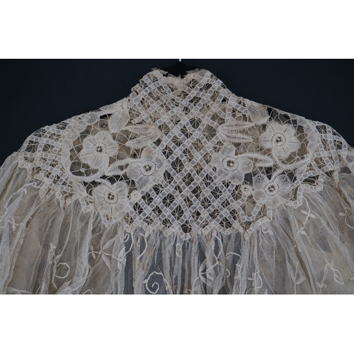 1507 - An Edwardian high collared cream tape lace wedding over blouse, made with a deep net frill and cream... 