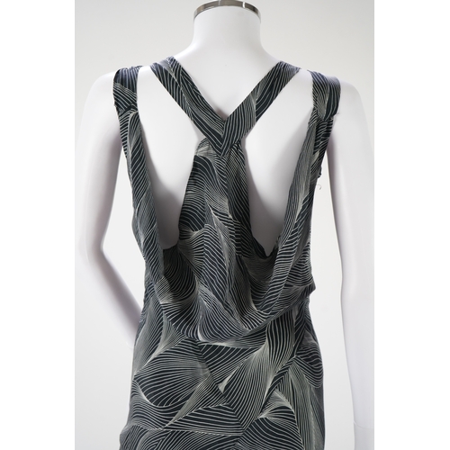 1510 - A 1930's black and silver halter neck, bias cut, ladies silk evening dress, designed with a loosely ... 