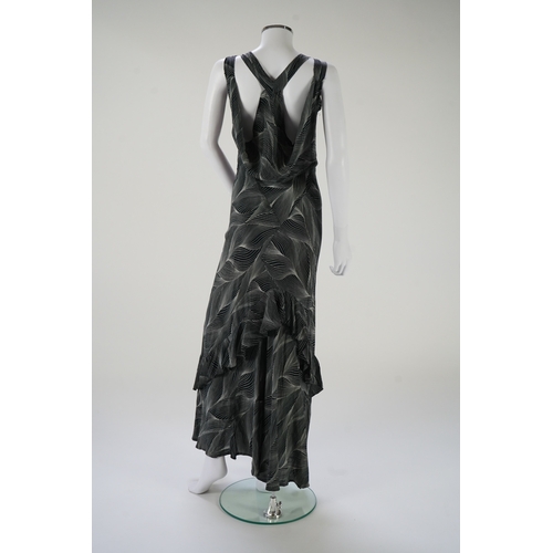 1510 - A 1930's black and silver halter neck, bias cut, ladies silk evening dress, designed with a loosely ... 