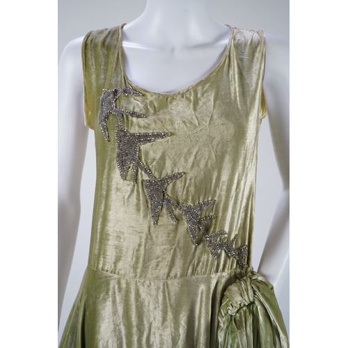 1511 - A late 1920s early 30s green panne silk velvet evening dress, bias cut, with large diamanté orname... 