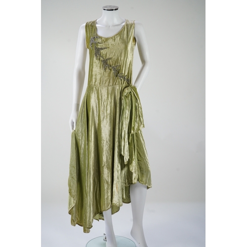 1511 - A late 1920s early 30s green panne silk velvet evening dress, bias cut, with large diamanté orname... 