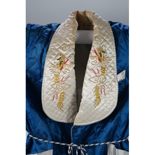 1515 - A mid 20th century Royal blue satin gentlemans smoking jacket and matching dressing gown with Chine... 