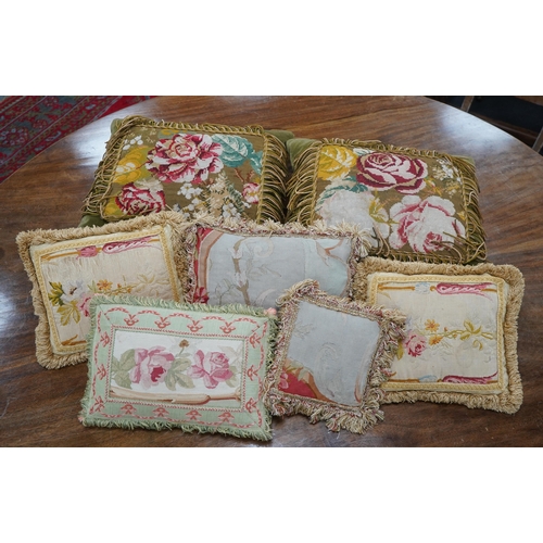 1522 - Seven 19th century cushions. Three Aubusson tapestry cushions and two machine Aubusson cushions, tog... 