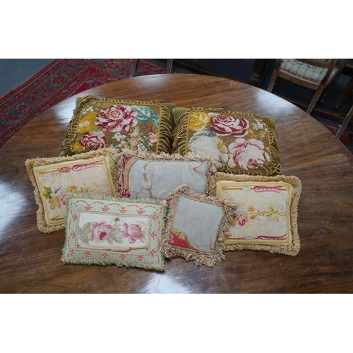 1522 - Seven 19th century cushions. Three Aubusson tapestry cushions and two machine Aubusson cushions, tog... 