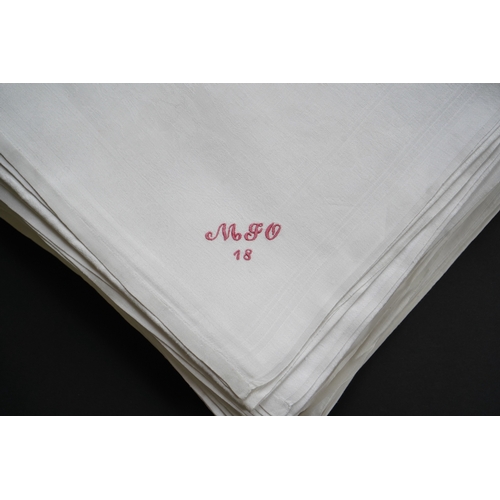 1523 - A set of nine red monogrammed 19th century large damask dinner napkins and a similar set of coarser ... 