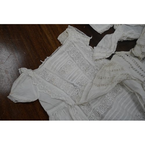 1526 - Five Victorian white worked fine cotton and lawn babys christening gowns. mostly worked with embroi... 