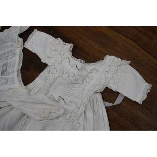 1526 - Five Victorian white worked fine cotton and lawn babys christening gowns. mostly worked with embroi... 