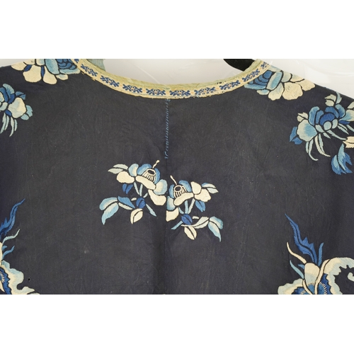 1531 - An early 20th century blue silk embroidered Chinese childs robe, embroidered with bats and flower m... 