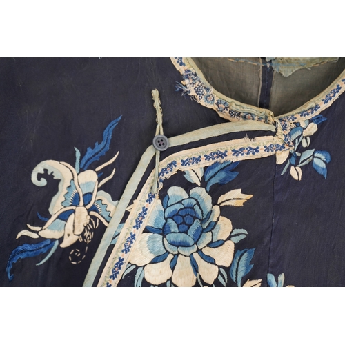 1531 - An early 20th century blue silk embroidered Chinese childs robe, embroidered with bats and flower m... 