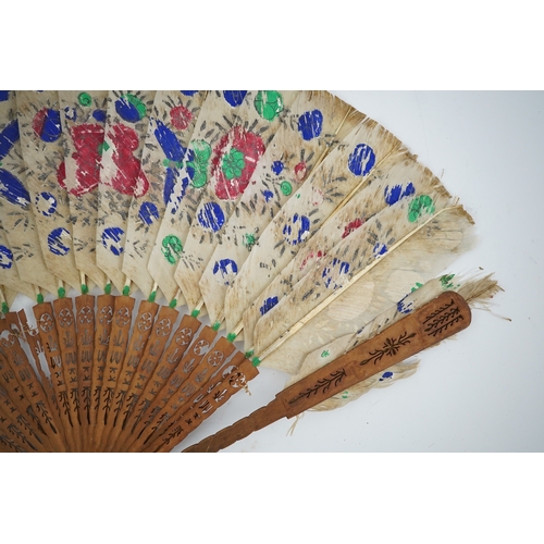 1532 - Three 19th century Chinese feather fans: One a carved bone brise black feather fan together with two... 