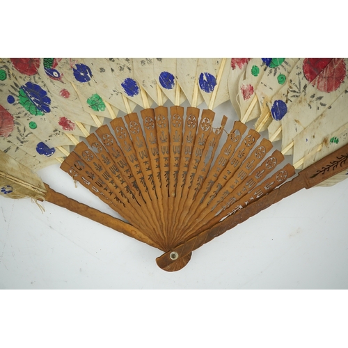 1532 - Three 19th century Chinese feather fans: One a carved bone brise black feather fan together with two... 