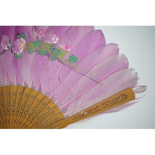 1532 - Three 19th century Chinese feather fans: One a carved bone brise black feather fan together with two... 