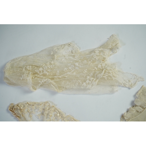 1536 - A suitcase containing a cream silk lace skirt to a dress, an Edwardian silk petticoat and various co... 