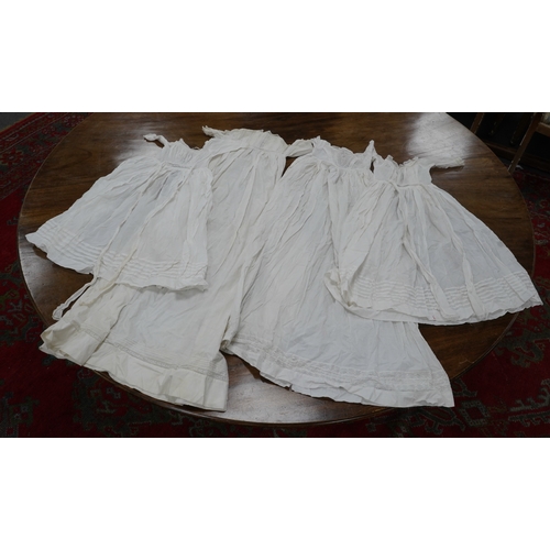 1537 - Two late 19th early 20th century long baby night gowns and two shorter baby gowns, together with a p... 