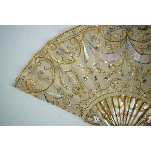 1540 - Three French fans: a mother of pearl and sequin fan boxed, a painted silk, feather and bone fan and ... 