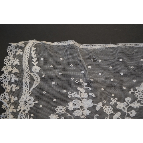 1546 - A deep elaborately designed flounce of mid 19th century Brussels bobbin appliquéd lace on net, with ... 