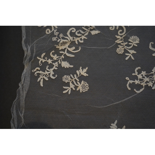 1547 - A 19th century five yard flounce of Brussels bobbin appliqué lace applied onto fine machine net, wor... 