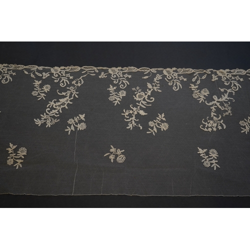 1547 - A 19th century five yard flounce of Brussels bobbin appliqué lace applied onto fine machine net, wor... 