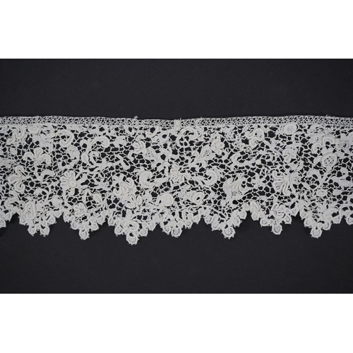 1548 - A late 17th century wide flounce of Point de France needle lace, together with a narrower flounce, b... 