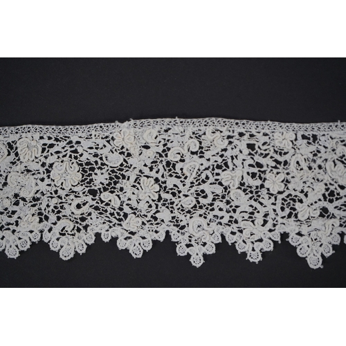 1548 - A late 17th century wide flounce of Point de France needle lace, together with a narrower flounce, b... 