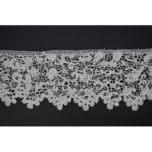 1548 - A late 17th century wide flounce of Point de France needle lace, together with a narrower flounce, b... 