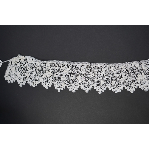 1548 - A late 17th century wide flounce of Point de France needle lace, together with a narrower flounce, b... 