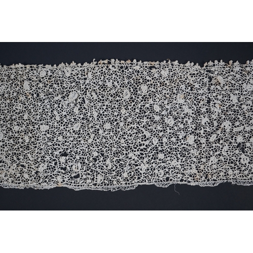 1548 - A late 17th century wide flounce of Point de France needle lace, together with a narrower flounce, b... 