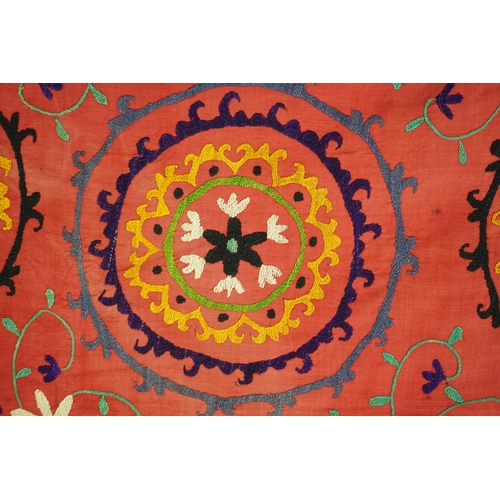 1557 - A large 20th century Uzbek multi coloured and embroidered Suzani wall hanging. The word Suzani meani... 