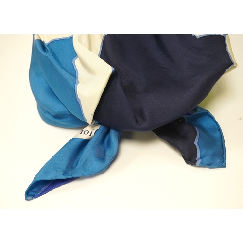 1560 - A 1960s ladies Christian Dior scarf hat, the scarf elaborately folded and tied at the back showing t... 