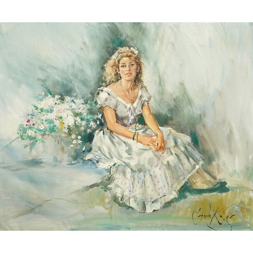 1796 - Gordon King (English, 1939-2022), oil on canvas, Young woman seated in a white dress, signed, 49 x 5... 