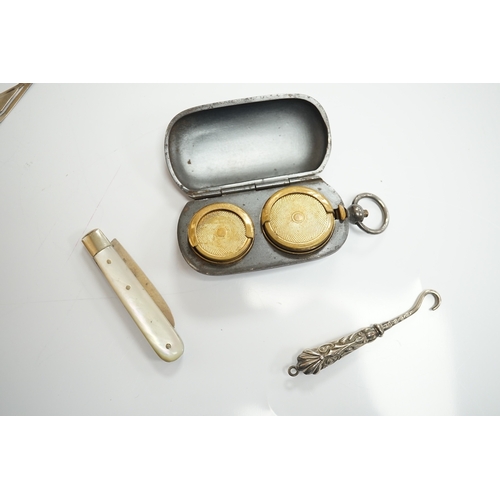 1826 - A small collection of mainly small silver items including a Victorian fruit knife, bookmarks, hare c... 