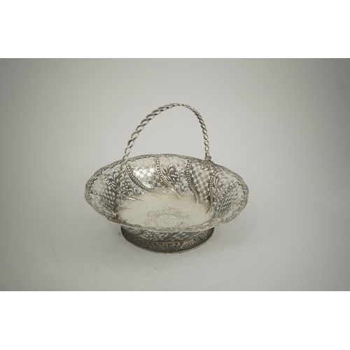 1861 - A late George II pierced silver cake basket, by William Plummer?, of shaped circular form, with engr... 