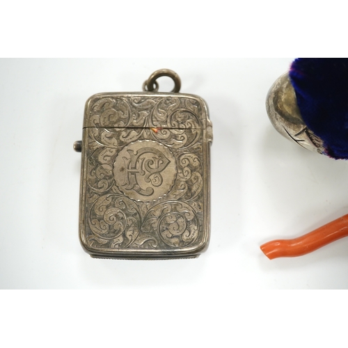 1865 - An unmarked white metal hatching chick pin cushion, height 44mm, an early Victorian coral and silver... 