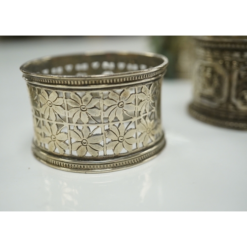 1879 - Two pairs of Victorian silver napkin rings and a George III silver wine funnel with later embossed d... 