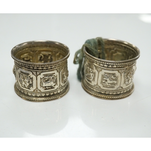 1879 - Two pairs of Victorian silver napkin rings and a George III silver wine funnel with later embossed d... 