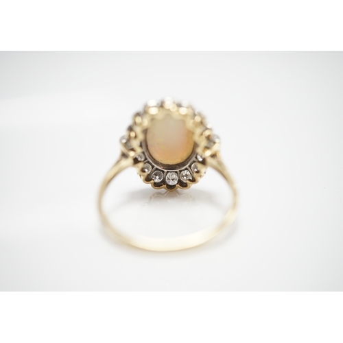 1911 - A mid 20th century 18ct, white opal, square and round cut diamond set oval cluster ring, size O, gro... 