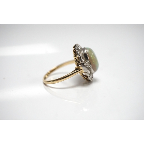 1911 - A mid 20th century 18ct, white opal, square and round cut diamond set oval cluster ring, size O, gro... 