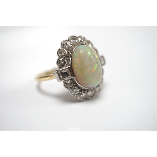 1911 - A mid 20th century 18ct, white opal, square and round cut diamond set oval cluster ring, size O, gro... 