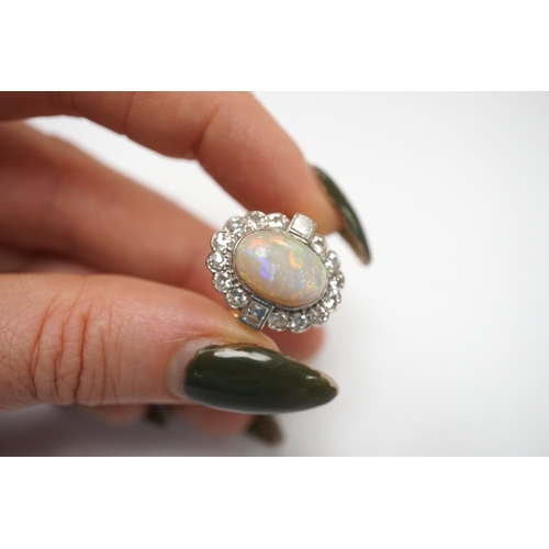 1911 - A mid 20th century 18ct, white opal, square and round cut diamond set oval cluster ring, size O, gro... 