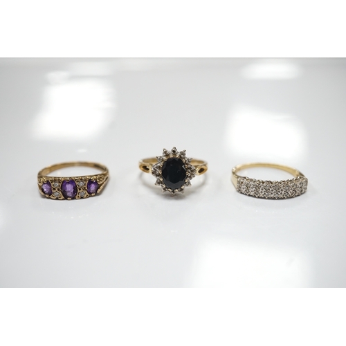 1912 - Three assorted 9ct and gem set rings including a diamond chip cluster half hoop and two pairs of yel... 