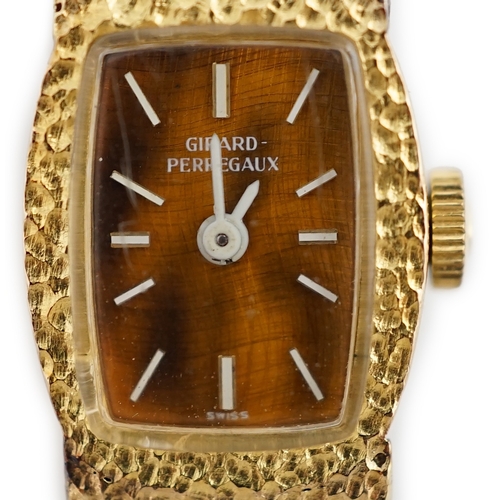 1914 - A lady's Girard Perregaux 18K cased wrist watch, with tiger's eye quartz dial, white hands and marke... 