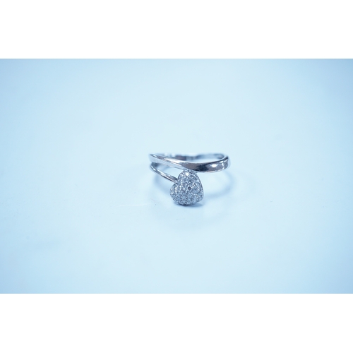 1929 - A modern 18k white metal and pave diamond set heart shaped ring, size H, gross weight 2.1 grams. Con... 