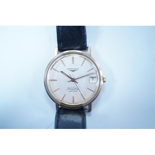 1937 - A gentleman's 9ct gold Longines Flagship automatic wrist watch, with baton numerals and date apertur... 