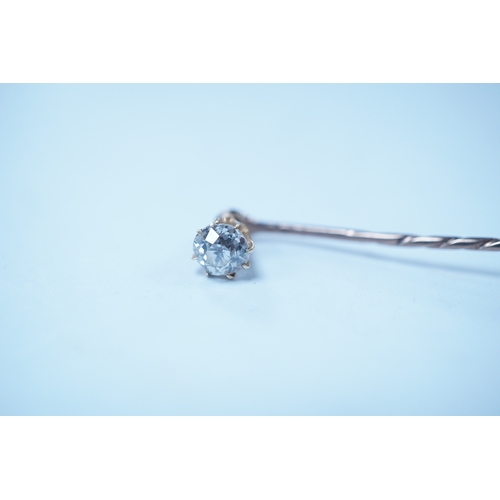 1939 - A yellow metal and solitaire diamond set stick pin, the stone diameter approx. 5mm, 59mm, gross weig... 