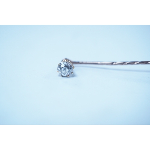 1939 - A yellow metal and solitaire diamond set stick pin, the stone diameter approx. 5mm, 59mm, gross weig... 