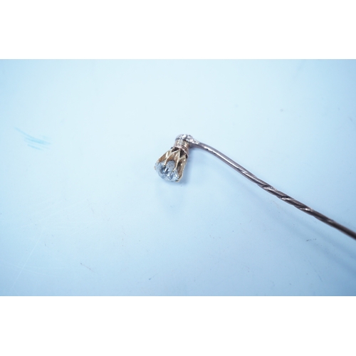 1939 - A yellow metal and solitaire diamond set stick pin, the stone diameter approx. 5mm, 59mm, gross weig... 